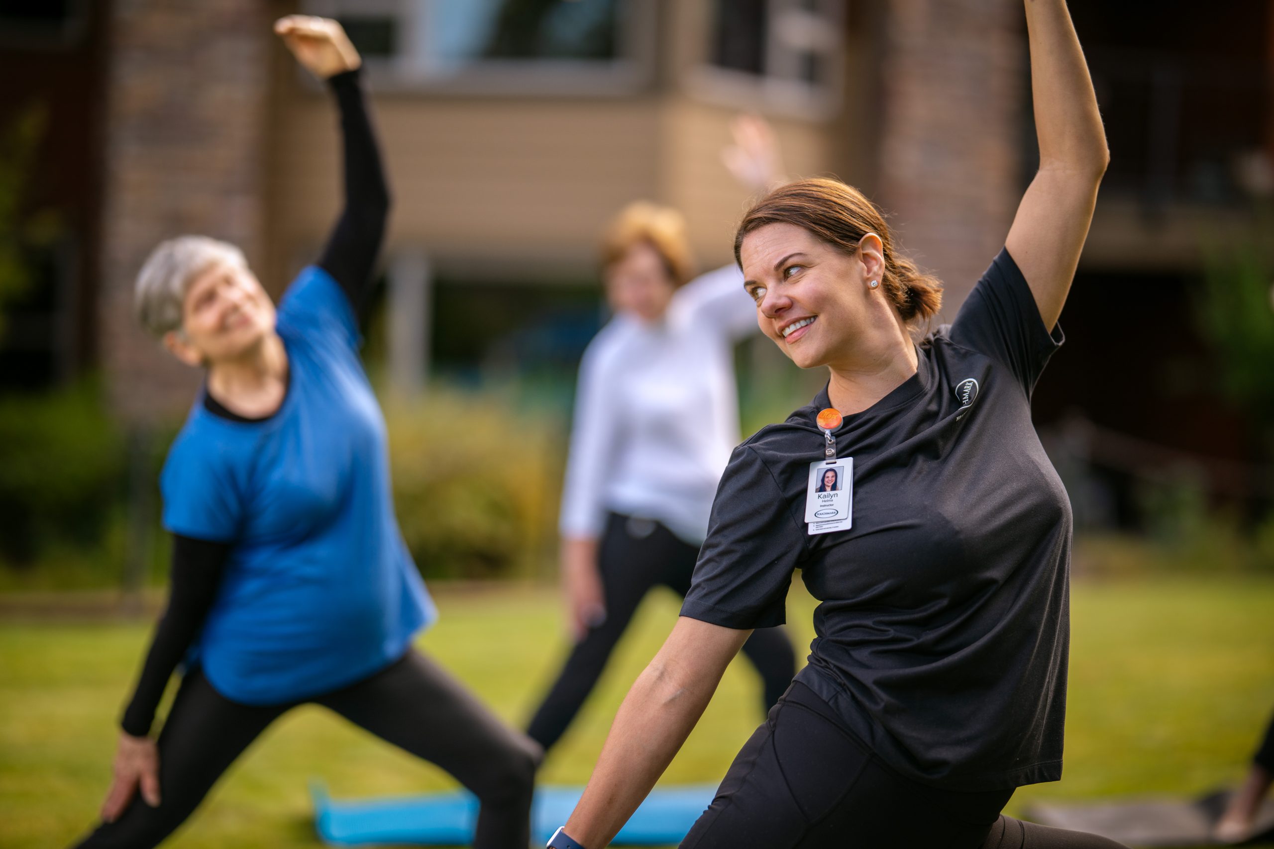 TM-Lifestyle-3-2247-web Touchmark team member leading residents in yoga class.